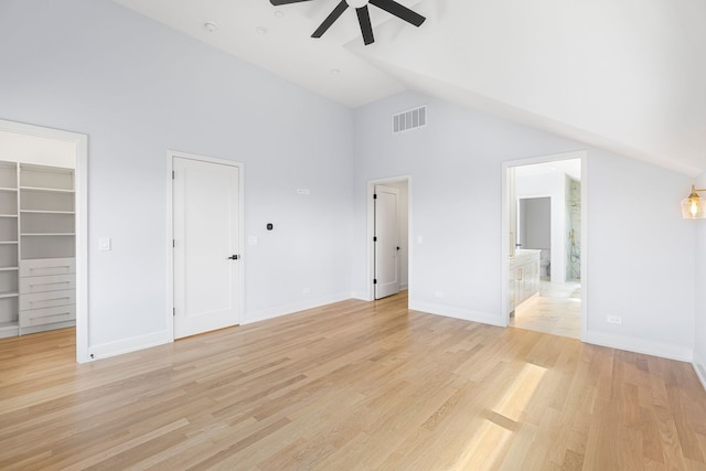 299 Cottage Ave, Glen Ellyn, IL 60137 - unfurnished bedroom featuring high vaulted ceiling, a walk in closet, light wood finished floors, ensuite bath, and baseboards