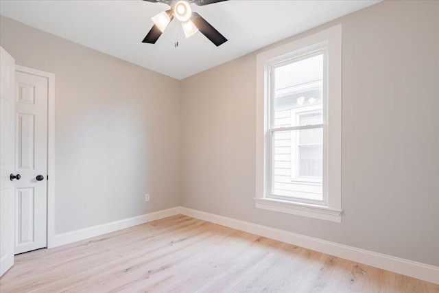 810 N Oak St, Bloomington, IL 61701 - spare room featuring light wood-style floors, plenty of natural light, baseboards, and ceiling fan