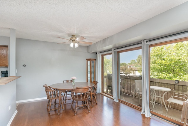 1068 Ashley Ct N Unit 2A, Lockport, IL 60441 - dining area featuring wood finished floors, ceiling fan, baseboards, and a textured ceiling