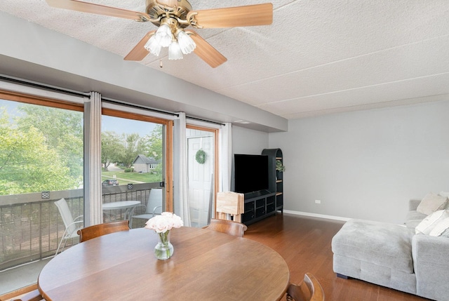 1068 Ashley Ct N Unit 2A, Lockport, IL 60441 - dining room with wood finished floors, a textured ceiling, a ceiling fan, and baseboards