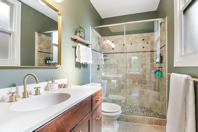 706 W Melrose Ave Unit 3, Chicago, IL 60657 - bathroom with toilet, vanity, a stall shower, and healthy amount of natural light