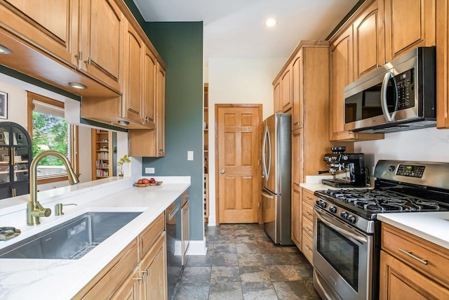 706 W Melrose Ave Unit 3, Chicago, IL 60657 - kitchen featuring appliances with stainless steel finishes, a sink, baseboards, stone finish flooring, and recessed lighting