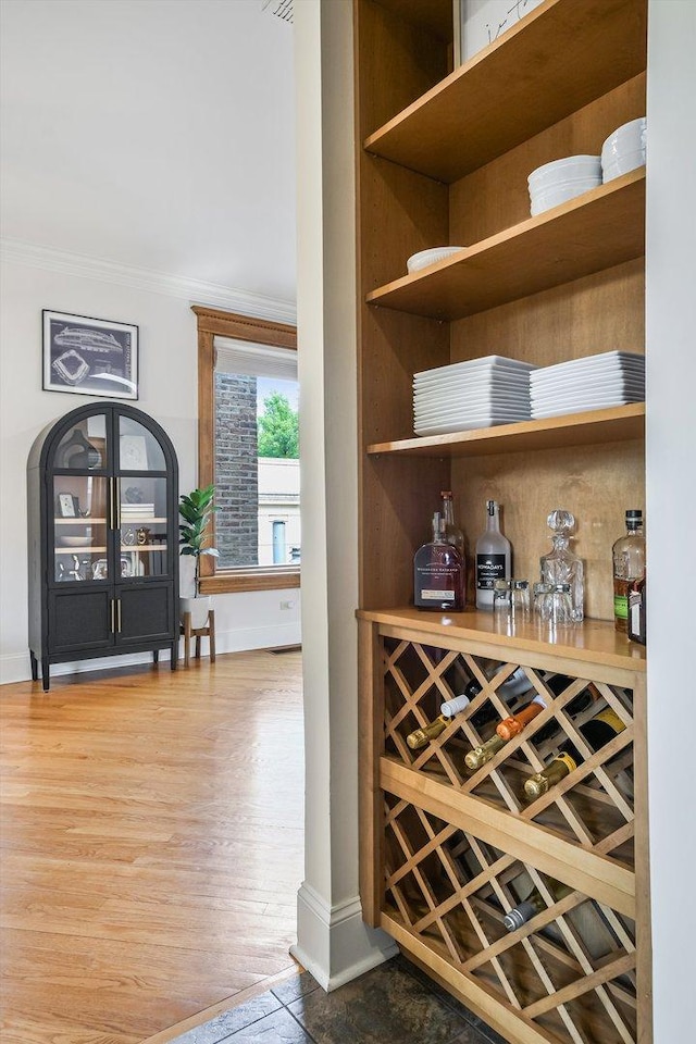 706 W Melrose Ave Unit 3, Chicago, IL 60657 - indoor dry bar featuring ornamental molding, baseboards, and wood finished floors