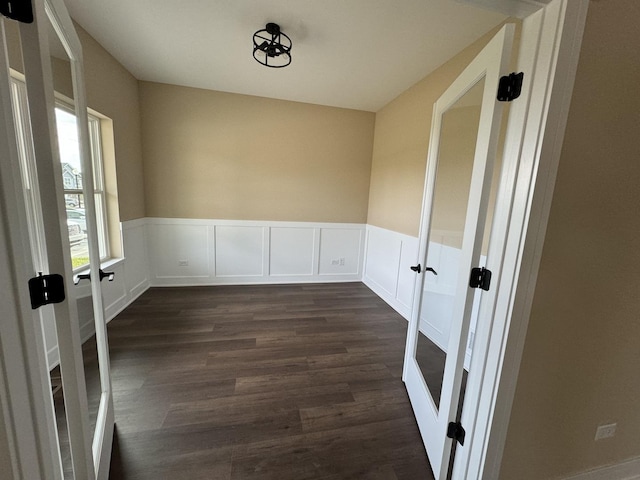 15937 Orchid Ln, Lockport, IL 60441 - empty room featuring french doors, dark wood-style flooring, and wainscoting