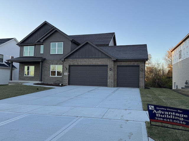 15937 Orchid Ln, Lockport, IL 60441 - craftsman house with board and batten siding, brick siding, an attached garage, concrete driveway, and a front yard