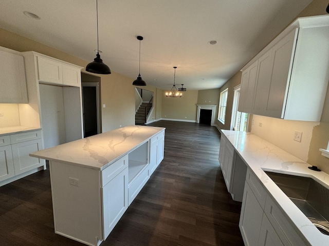 15937 Orchid Ln, Lockport, IL 60441 - kitchen featuring dark wood-type flooring, light stone counters, white cabinetry, a center island, and recessed lighting