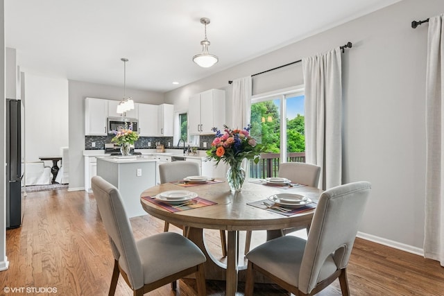 0N611 W Weaver Cir, Geneva, IL 60134 - dining area with light wood-style floors and baseboards
