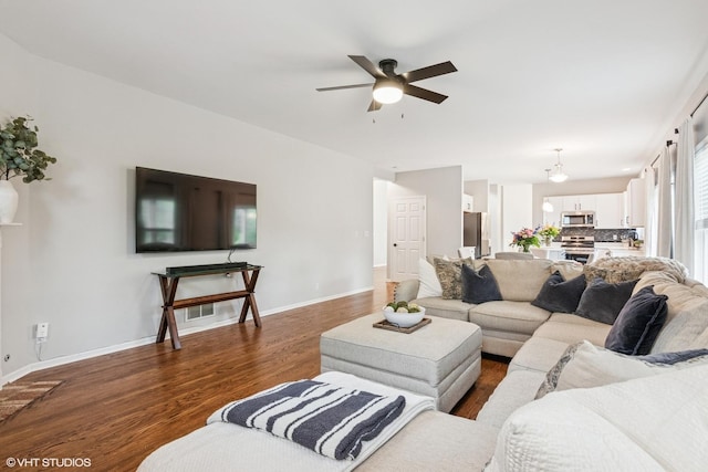 0N611 W Weaver Cir, Geneva, IL 60134 - living room featuring ceiling fan, dark wood-style flooring, and baseboards