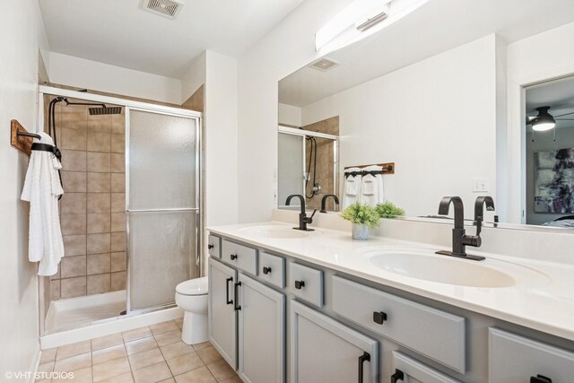 0N611 W Weaver Cir, Geneva, IL 60134 - full bathroom featuring double vanity, a stall shower, tile patterned floors, and toilet