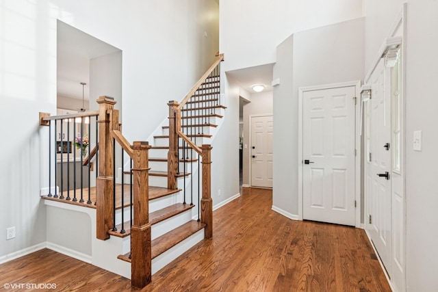 0N611 W Weaver Cir, Geneva, IL 60134 - stairway with a towering ceiling, wood finished floors, and baseboards