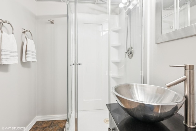 0N611 W Weaver Cir, Geneva, IL 60134 - bathroom featuring a sink, a shower stall, and baseboards