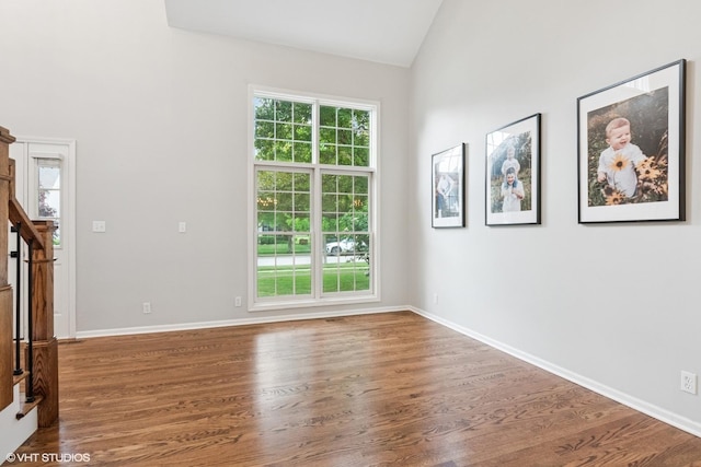 0N611 W Weaver Cir, Geneva, IL 60134 - unfurnished living room with wood finished floors, vaulted ceiling, and baseboards