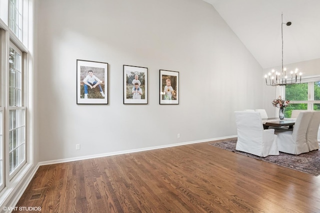 0N611 W Weaver Cir, Geneva, IL 60134 - dining room with high vaulted ceiling, a chandelier, wood finished floors, and baseboards