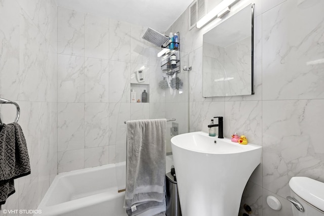 655 W Irving Park Rd Unit 2903, Chicago, IL 60613 - full bath featuring tile walls, toilet, and shower / bath combination