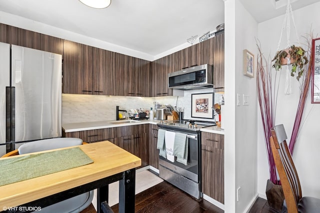 655 W Irving Park Rd Unit 2903, Chicago, IL 60613 - kitchen with stainless steel appliances, a sink, modern cabinets, light countertops, and backsplash