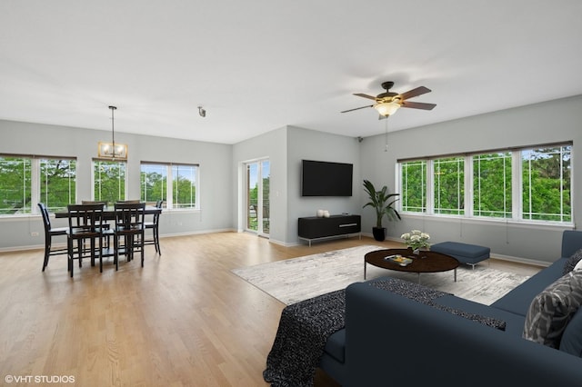 911 Busse Hwy Unit 302, Park Ridge, IL 60068 - living area with baseboards, plenty of natural light, and a chandelier