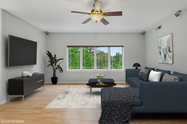 911 Busse Hwy Unit 302, Park Ridge, IL 60068 - living area with light wood finished floors, ceiling fan, and baseboards