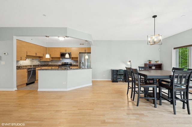 911 Busse Hwy Unit 302, Park Ridge, IL 60068 - dining room featuring light wood-type flooring, a chandelier, and baseboards