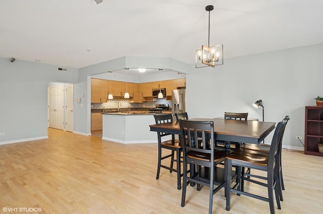 911 Busse Hwy Unit 302, Park Ridge, IL 60068 - dining area featuring light wood-type flooring, a chandelier, and baseboards