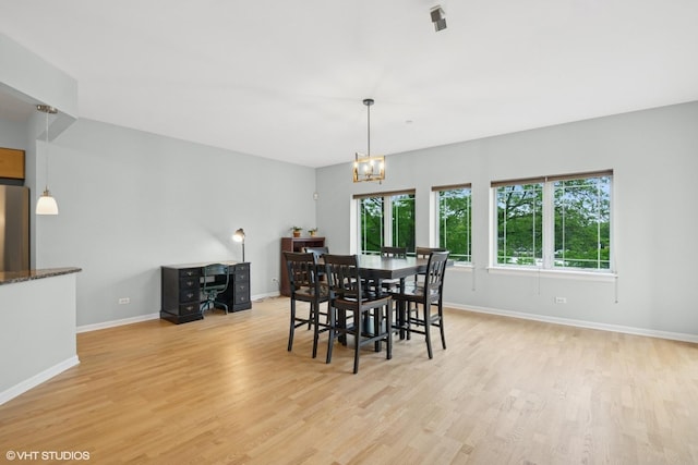 911 Busse Hwy Unit 302, Park Ridge, IL 60068 - dining space featuring baseboards, light wood-type flooring, and a chandelier