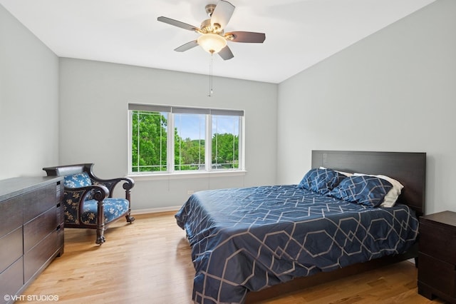 911 Busse Hwy Unit 302, Park Ridge, IL 60068 - bedroom featuring wood finished floors, baseboards, and a ceiling fan