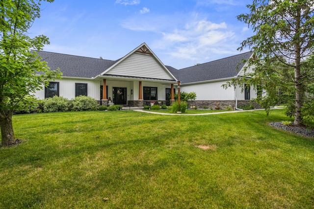 4203 Curtis Meadow Dr, Champaign, IL 61822 - modern inspired farmhouse featuring a front lawn, a shingled roof, and covered porch