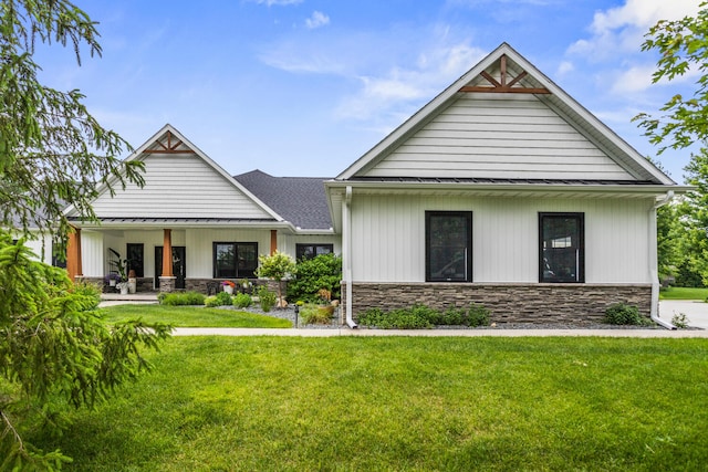 4203 Curtis Meadow Dr, Champaign, IL 61822 - modern farmhouse style home featuring stone siding and a front yard