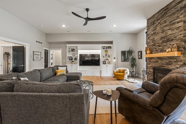 4203 Curtis Meadow Dr, Champaign, IL 61822 - living room with light wood-style floors, ceiling fan, a fireplace, and recessed lighting