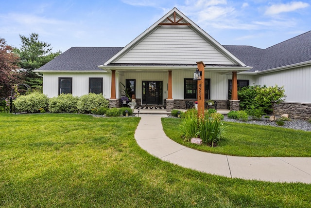 4203 Curtis Meadow Dr, Champaign, IL 61822 - modern inspired farmhouse with a porch, a front lawn, and stone siding