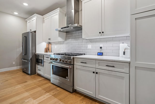 4203 Curtis Meadow Dr, Champaign, IL 61822 - kitchen with high quality appliances, wall chimney range hood, light countertops, light wood finished floors, and recessed lighting