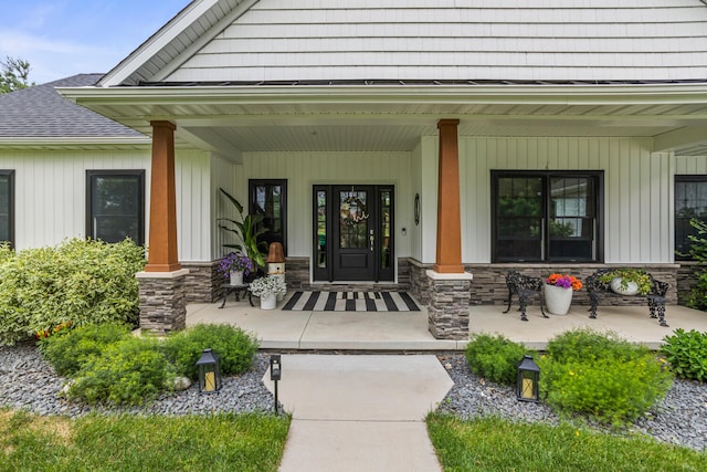 4203 Curtis Meadow Dr, Champaign, IL 61822 - entrance to property featuring covered porch and stone siding