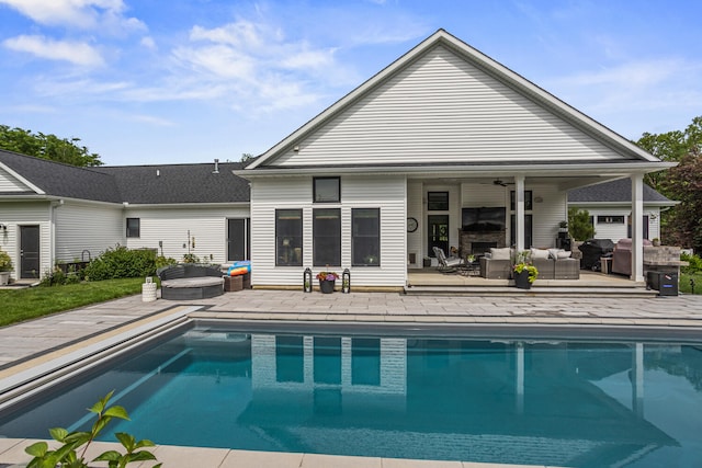 4203 Curtis Meadow Dr, Champaign, IL 61822 - back of property featuring outdoor lounge area, an outdoor pool, and a patio
