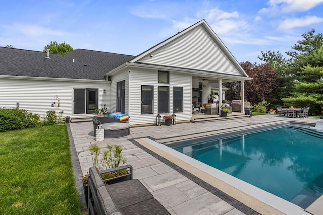 4203 Curtis Meadow Dr, Champaign, IL 61822 - back of house with an outdoor living space, a patio, a yard, and an outdoor pool