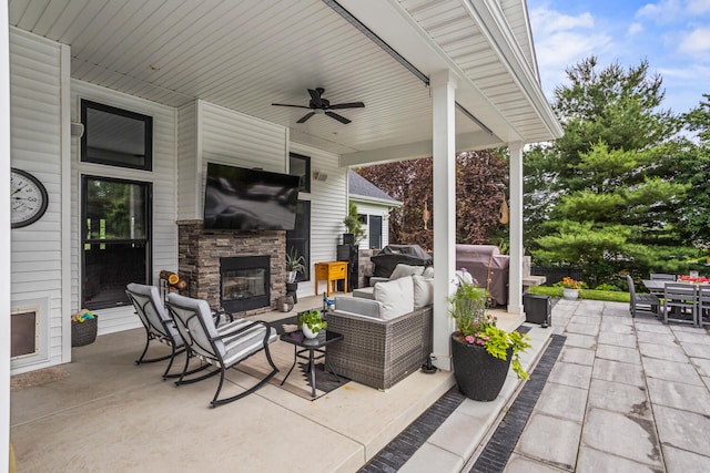 4203 Curtis Meadow Dr, Champaign, IL 61822 - view of patio with an outdoor living space with a fireplace, ceiling fan, and outdoor dining space