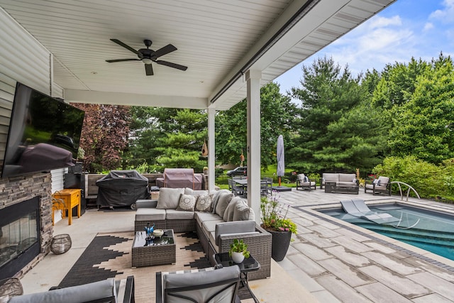 4203 Curtis Meadow Dr, Champaign, IL 61822 - view of patio / terrace with an outdoor living space with a fireplace, an outdoor pool, outdoor dining space, ceiling fan, and view of wooded area
