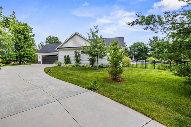 4203 Curtis Meadow Dr, Champaign, IL 61822 - view of front facade with driveway, a shingled roof, and an attached garage