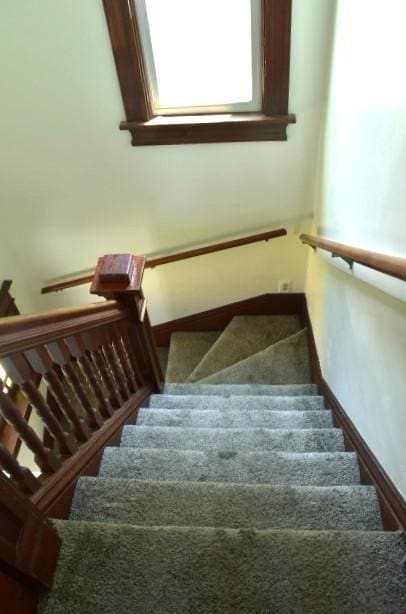 1207 4th Ave, Sterling, IL 61081 - stairway featuring baseboards