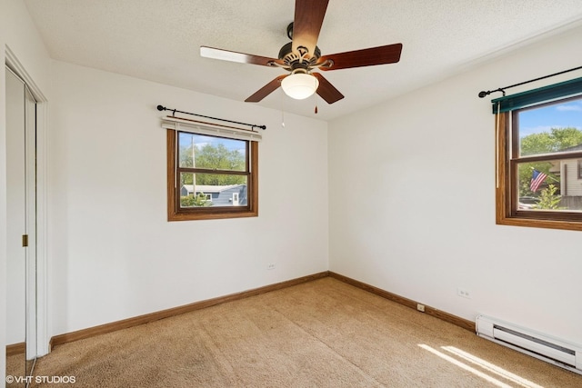 325 Larkdale Row, Wauconda, IL 60084 - empty room with a baseboard radiator, light colored carpet, a ceiling fan, and a textured ceiling
