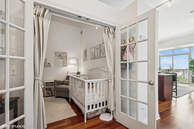 230 W Division St Unit 1208, Chicago, IL 60610 - bedroom featuring dark wood finished floors and a nursery area