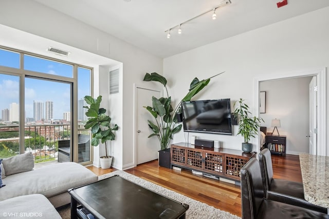 230 W Division St Unit 1208, Chicago, IL 60610 - living room with wood finished floors, rail lighting, and a view of city