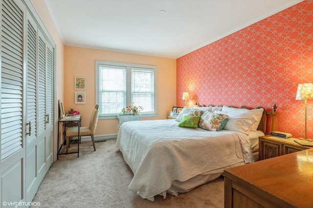 239 Imperial St, Park Ridge, IL 60068 - bedroom with wallpapered walls, crown molding, an accent wall, light carpet, and a closet