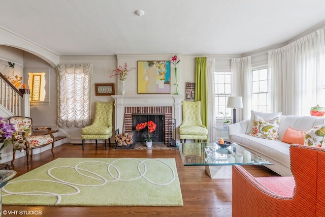 239 Imperial St, Park Ridge, IL 60068 - living area with wood finished floors, a brick fireplace, stairway, and ornamental molding