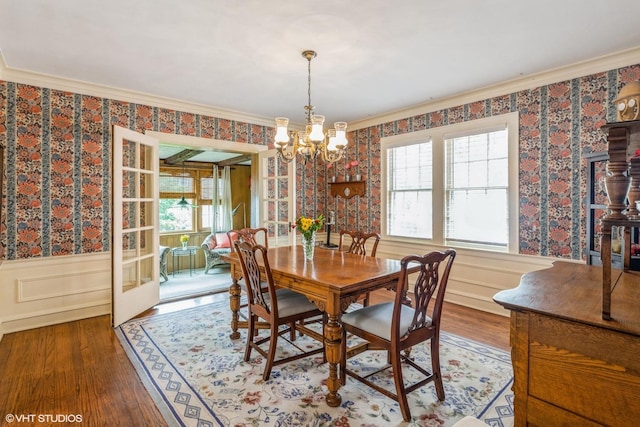239 Imperial St, Park Ridge, IL 60068 - dining room with a chandelier, wood finished floors, wallpapered walls, wainscoting, and crown molding