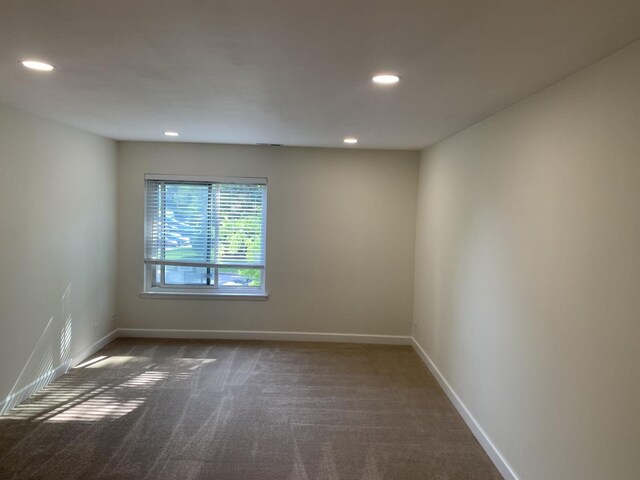 245 Park Ln Unit 208, Palatine, IL 60074 - spare room with dark colored carpet, recessed lighting, and baseboards