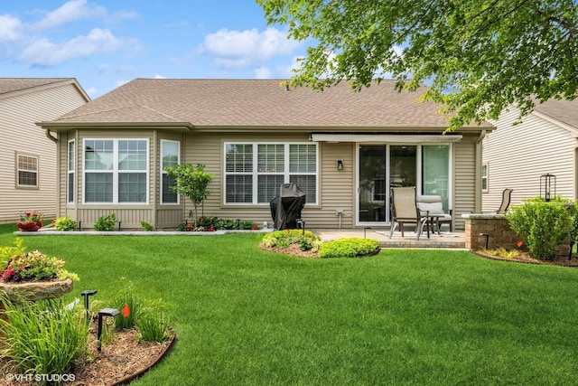 2771 Cascade Falls Cir, Elgin, IL 60124 - rear view of house with a patio, a lawn, and a shingled roof