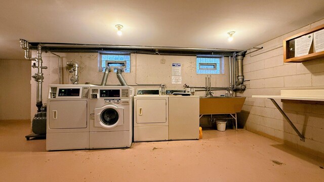 3161 Paris Ave N Unit 104, River Grove, IL 60171 - community laundry room featuring washer and dryer, plenty of natural light, and concrete block wall