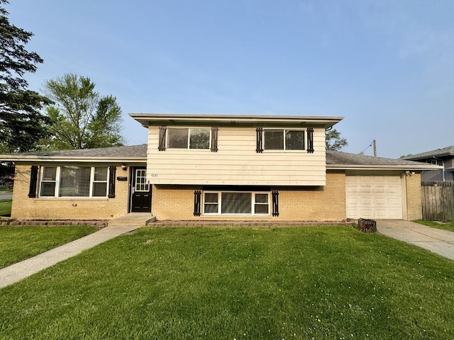 4230 Barry Ln, Oak Forest, IL 60452 - split level home with a garage, brick siding, and driveway