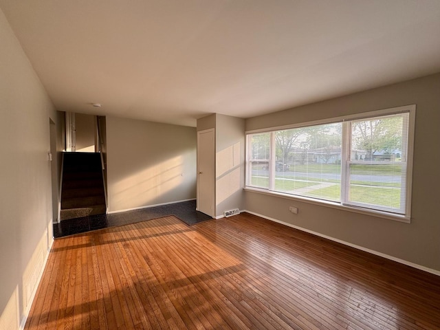 4230 Barry Ln, Oak Forest, IL 60452 - unfurnished living room with hardwood / wood-style flooring, stairway, and baseboards
