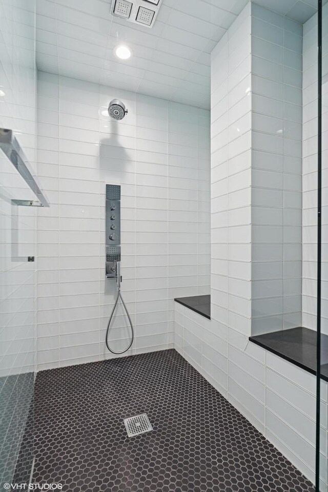 411 W Ontario St Unit 201-302, Chicago, IL 60654 - bathroom featuring a tile shower, recessed lighting, and tile patterned flooring