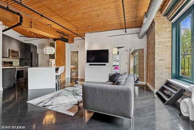411 W Ontario St Unit 201-302, Chicago, IL 60654 - living area featuring healthy amount of natural light, wooden ceiling, dark wood-type flooring, baseboards, and brick wall